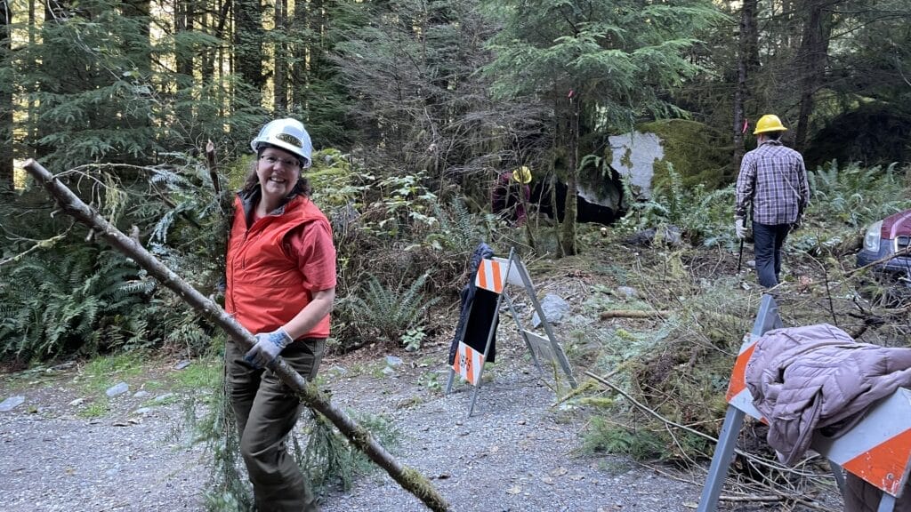 Volunteers clearing brush at Snoqualmie Lake Trailhead