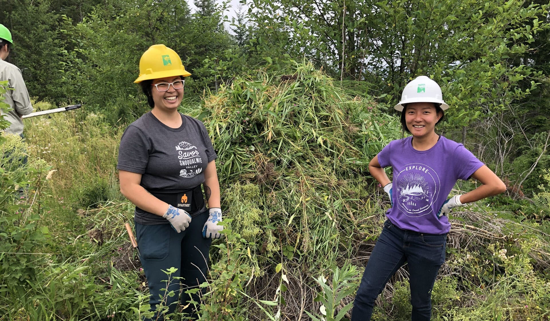 Two women standing in front of restoration work site