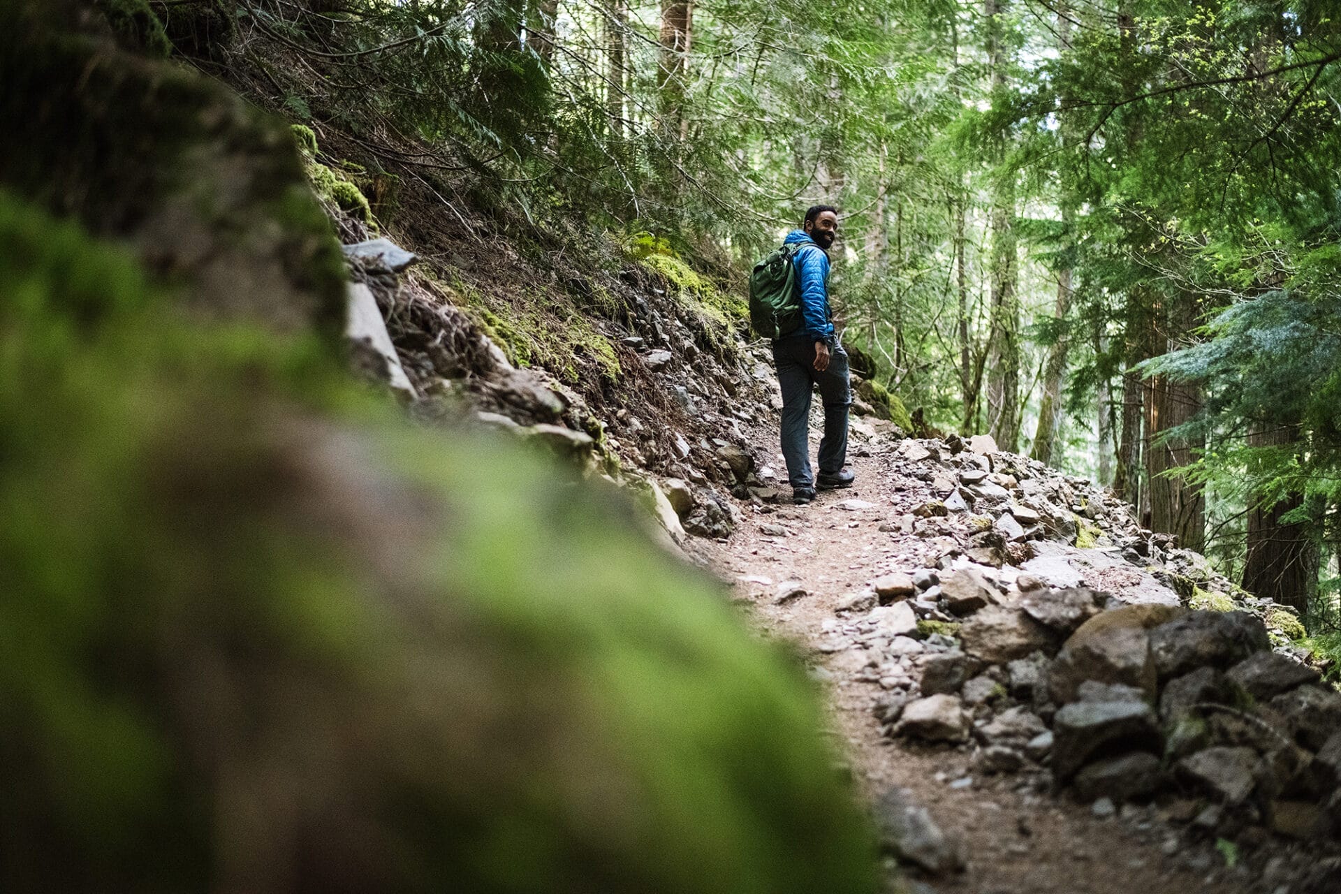 Person looking back over their shoulder on a walk