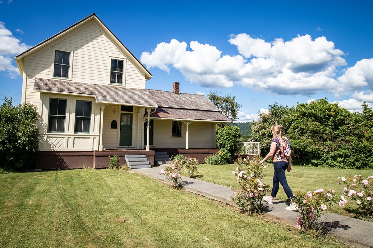 Woman walking up to the Dougherty Farmstead, one of many fun things to do in Duvall, WA