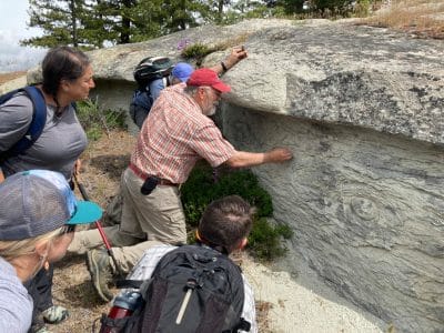 Karl Lillquist points out features of the Roslyn Sandstone formation to event attendees on the hike to Cheese Rock.