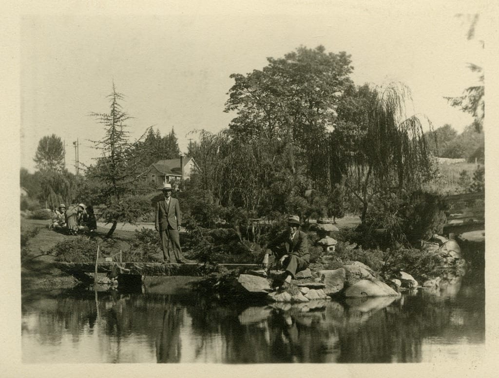 Visitors in the Kubota Garden overlooking a pond